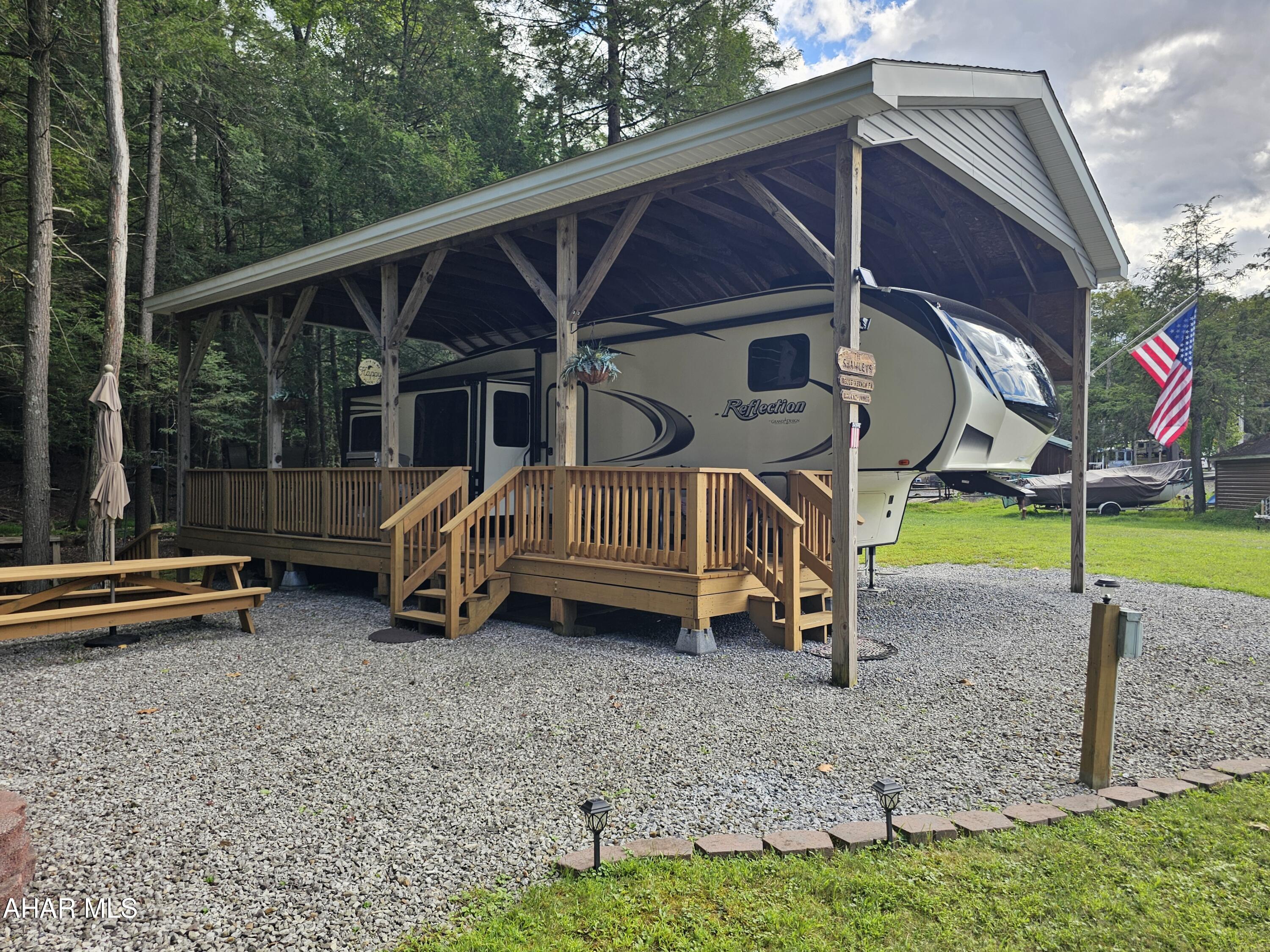 2019 Reflection 5th wheel camper on 1 lot inside Glendale Yearound. Beautifully maintained with 1 bedroom and 1 bathroom. 
Looks and feels like brand new. Deck and pavilion over camper. Shed included. Stream and woods behind lot. Glendale Yearound is a gated community located minutes from Prince Gallitzin State Park and Glendale Lake.
Community pool, basketball, tennis, and more.