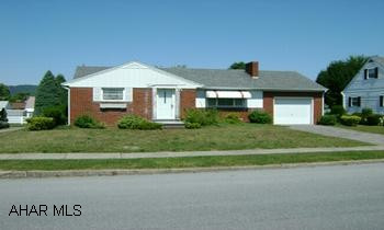 Brick rancher in town.  Two bedrooms, one car garage, close to stores, restaurants, pharmacies, hospital, banks. One story living!.