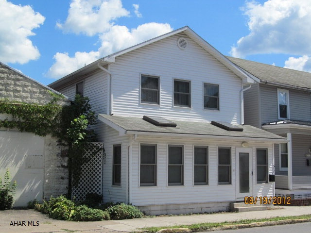 This Bellwood Boro home must be seen to be appreciated!  Extremely spacious inside with 3 BR's, large kitchen and LR, C/A, front sunroom with skylights, and within walking distance to schools and stores on Main St. Plenty of closets and storage space.