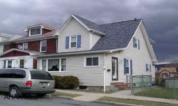 2 STORY VINYL SIDED WITH DETACHED GARAGE. SUPER ATTRACTIVE 2 STORY. NEW SIDING, ROOF, WINDOWS, KITCHEN & BATH. SHOWS BEAUTIFULLY. NEWER FURNACE WITH A/C. HUGE DECK PORCH. GARAGE AND PARKING PAD. FENCED YARD.