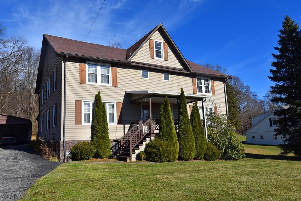 Lots of options!  This spacious home in the Forest Hills School District sits on one acre of partly wooded land.  With 6 bedrooms and 4 bathrooms, it offers the possibility of creating an income property or the conversion into to a substantial, single-family home.  Enjoy the large lower deck or the 2nd-floor balcony while watching the backyard wildlife.  This home also has a two-car carport and a lower, integrated garage with space for a workshop, your lawn mower, motorized toys, and additional storage.
