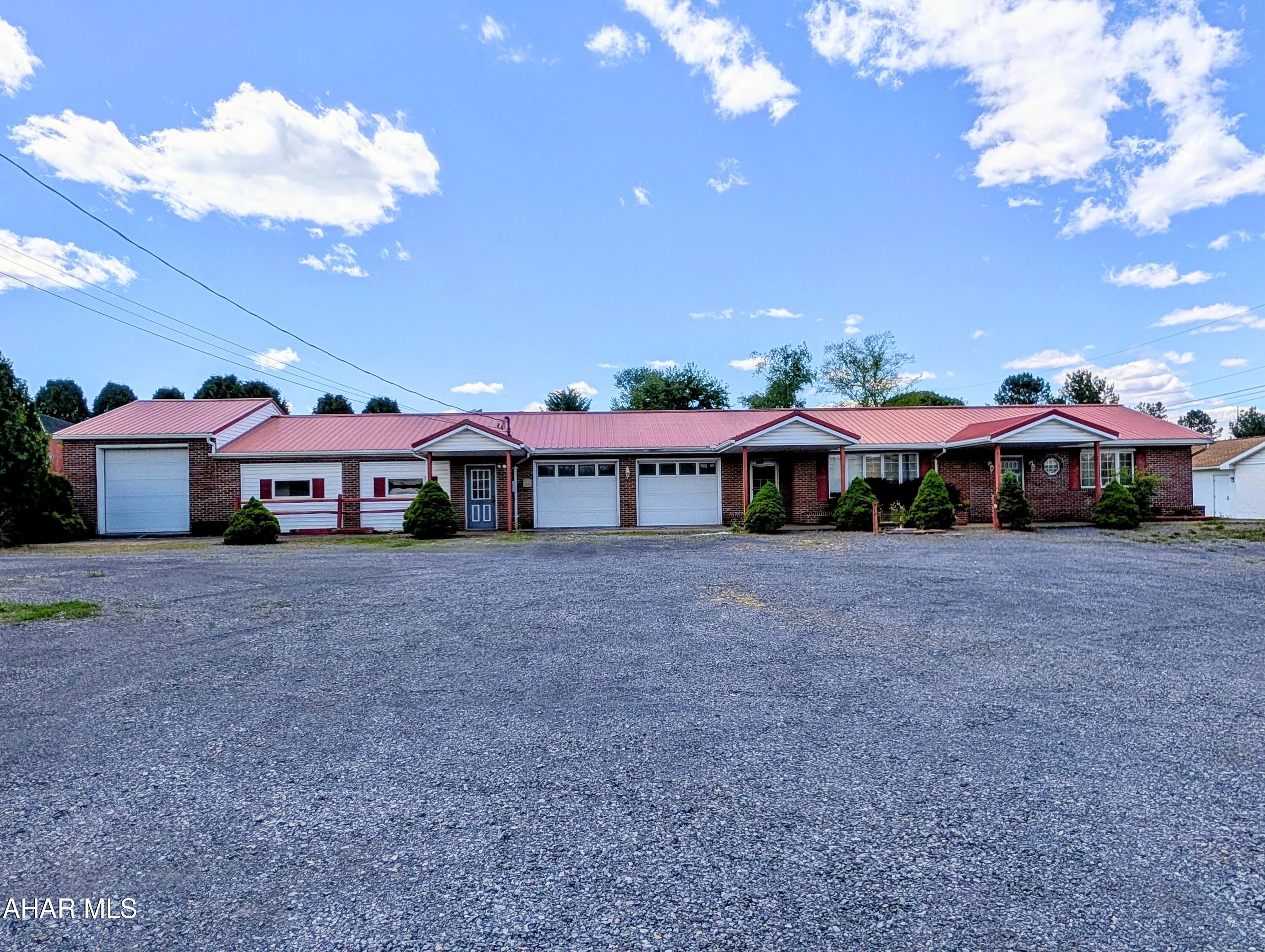 Great opportunity to own a mixed use commercial building in Bedford Township.  Near the Bedford Intusdrial park and other prominanat businesses.  It was previously a small lot car dealership, office building and 2 apartments.  With a little effort this can be restored and ready for a new business.  Located minutes from the PA turnpike, I99, and Rt 30.  (Pipes froze in the apartment side of property this February.  Water currently shut off.)