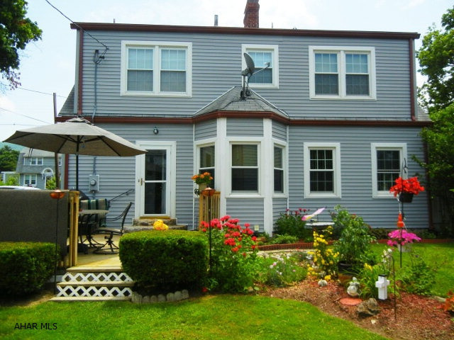 CHARMING AND PRISTINE!  LARGER THAN IT LOOKS! Walk to Bishop Gilfoyle! 3 bed, one on 1st floor with 1/2 bath can also be used as a den/office.  2 large 13x25 bedrooms on 2nd floor with walk in closets and storage.  2 fireplaces, 1 gas and 1 wood.  Original hardwood floors, woodwork and builtins throughout.  Large basement has a man cave family room with wood fireplace and a large laundry/utility/storage area.  New siding, doors, windows and countertop.  HUGE detached 2 story 2+ car garage has second floor partially finished and insulated for work area or extra living with separate electric installed. Gas, water ready for buyer hook up. Lawn and gardens are fenced for privacy and security.   Close to schools, shopping, interstate highways and public transportation!  Home Warranty!