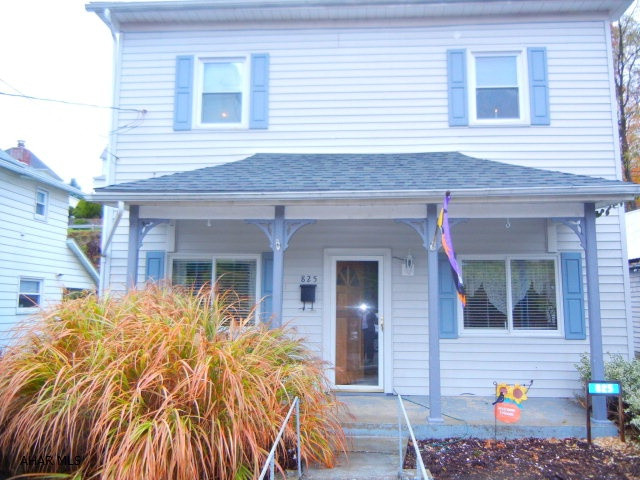OPEN HOUSE, SUNDAY, DECEMBER 6TH (2:30 -4:00)  This home is larger than it looks!  It also offers a spacious sunroom in the rear of the home. Nice covered patio as well.   Large kitchen PLUS separate dining room, living room is spacious.  Also offers 1/2 bath and laundry on main level for convenience. 2 BR and full BA on 2nd level.  Off street parking for at least 2 cars in rear.  (2) 275 gallon oil tanks enable you to stock up while costs are low in the off season months!  FORMER ADDRESS:  825 E MAIN STREET, ROARING SPRING