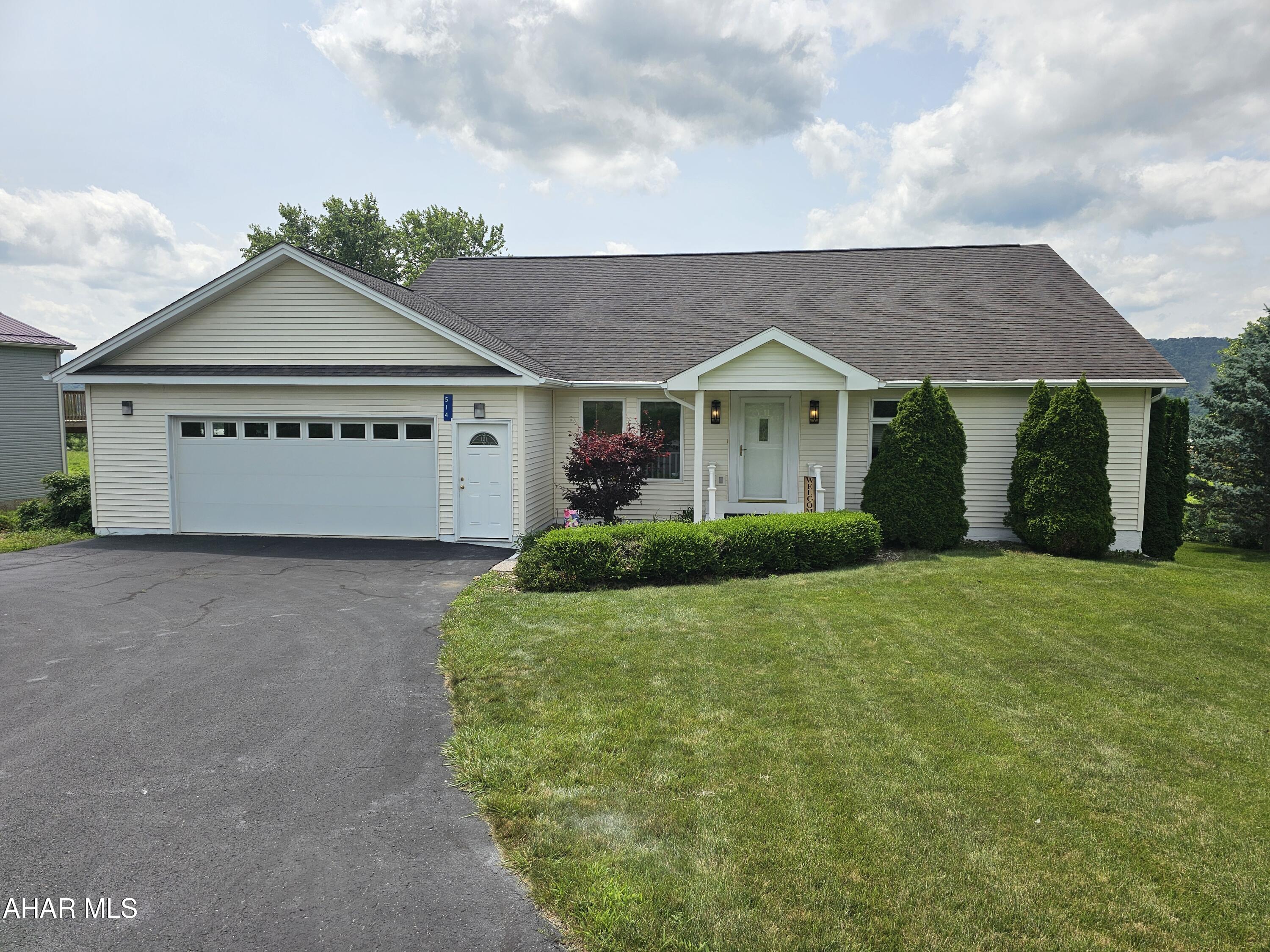 This gorgeous home has everything you need, a wide open  floor plan with beautiful views of the Cove, , central air for these warm summer days. This home has a totally finished in law suite with a full kitchen, bath, two bedrooms and an office space also a private entrance, mini split for ac and extra heat in the basement. You could also  use  this for a rental for extra income. Or that growing   family looking for extra space to spread out. There in an extra parcel that goes with the property it is 0.3 acres.
The yard has thornless blackberries, Concord grapes, raspberries. The spare lot has a blueberry patch, so if you are an avid gardener you will love this one.
The inside of the home has been freshly painted throughout and some carpet replaced and what hasn't been has been professionally cleaned. Call me today to schedule a tour of this beautiful home.
