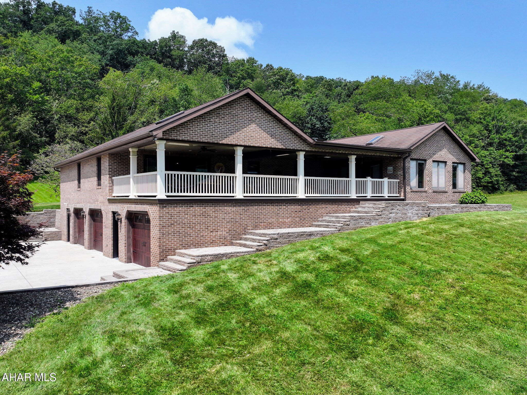 This 3,080 sq. ft. brick ranch sits on 13.95 acres, offering space, privacy, and plenty of ways to enjoy the outdoors. The covered front deck is perfect for morning coffee or relaxing in the evening, with peaceful mountain views all around. Both the living room and primary bedroom open directly to this inviting space, making it easy to step outside anytime. Inside, the vaulted beam ceiling in the living room adds character, and the full dining room is great for family meals or gatherings with friends. Out back, summer days are made for the in-ground swimming pool, whether you're cooling off, hosting a party, or just lounging in the sun. The unfinished basement gives you options for future living space, and the oversized 3-car integral garage has room for vehicles, hobbies, a workshop, and extra storage. This home combines comfort, function, and room to grow in a beautiful setting. Give us a call today to make this your next home!