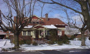 Charming brick in convenient neighborhood, presently two family, could be converted to one family. Large lot, large side porch.