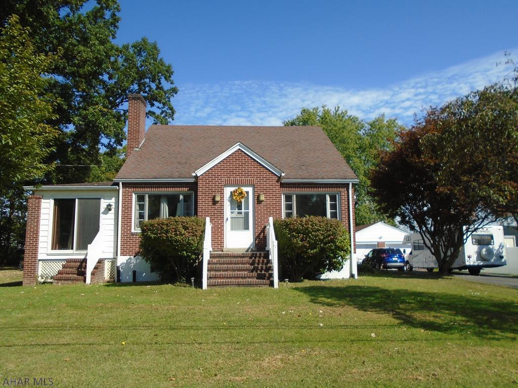 Endearing 1.5 story brick home situate on a secluded 0.7 acre lot. 3 bedroom with a nice bonus room. Full bath with laundry shoot!! Partially finished basement with sauna and 3/4 bath.  Plenty of workshop space and storage in basement. 2 car garage with car port. Foot of Ten Elementary--Hollidaysburg School District. Call listing agent for your personal tour.