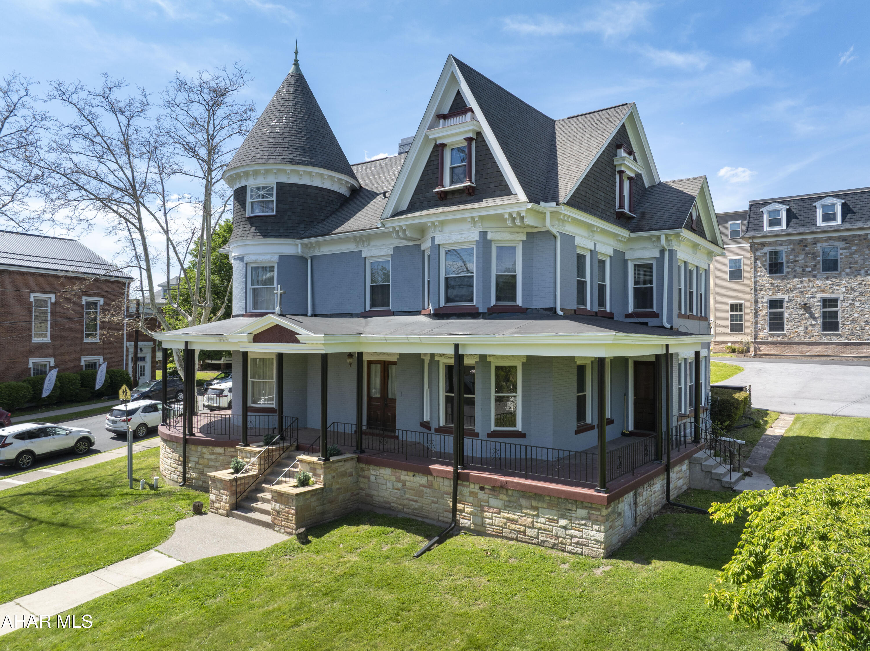 Own a piece of Hollidaysburg history at 501 Walnut Street. This extraordinary 7-bedroom, 6.5-bath Victorian showcases timeless architecture, some modern updates, and unforgettable character in one of the area's most historic settings. From the iconic turret and expansive wraparound porch to the stunning original woodwork, hardwood floors, and stained-glass details, this home is filled with charm at every turn. Inside, spacious living and entertaining areas are complemented by an updated kitchen. Large windows provide abundant natural light throughout, while the home's unique architectural features create warmth and elegance rarely found today. Situated on a prominent corner lot in historic Hollidaysburg, this remarkable property offers endless possibilities as a private residence, multi-generational home, or potential bed & breakfast/investment opportunity. A rare opportunity to own one of Hollidaysburg's most distinctive homes.