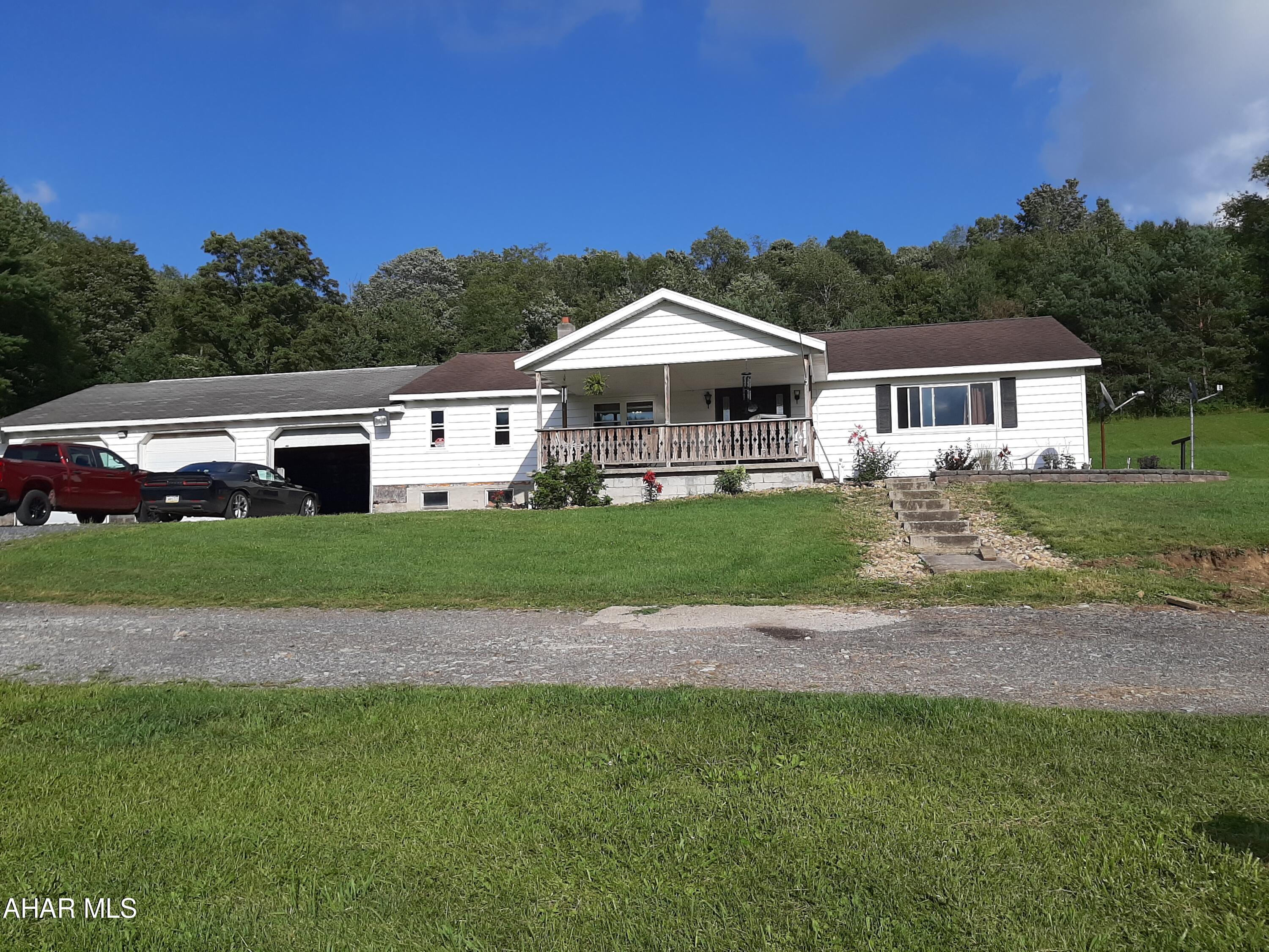 Welcome to this country setting in Penn Cambria School District. This ranch home offers 3 bedrooms and 1 full bath and 1/2 bath in the basement. Walk in from the 3 car garage into the breezeway that houses the laundry, plenty of storage and a place to kick off your shoes. The well equipped eat in kitchen offers plenty of cabinet storage and breakfast bar. The large living room offers room for entertaining with a beautiful view from the front window. The full bath offers a jacuzzi tub/shower combo and plenty of storage. And three nice sized bedrooms all with great storage options. The primary bedroom has the space for an additional bath to be finished. Outside you will find the above ground pool and a 30x55 barn that currently is housing 1 goat and 1 lamb. A feed bin, running water and electric also accompany the barn. This property is a must see! Call for your personal tour today!!