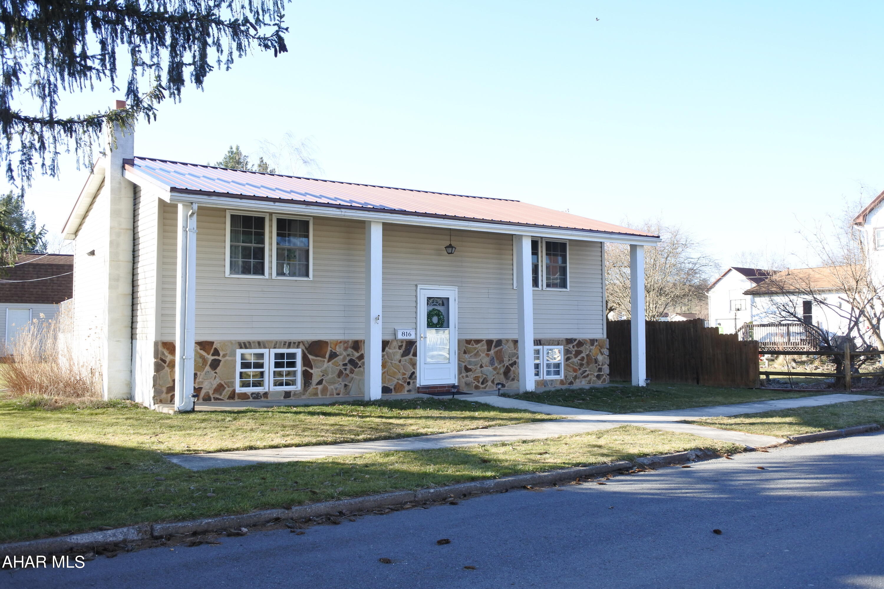 Move in ready home located in Bellwood School District.  3 Bedrooms and 2 Bathrooms, kitchen appliances are included.  Relax in the lower level...huge Family room with bar and gas FP. Very good mechanics, new metal roof and hot water heater. Level lot with shed for storage....additional storage under the over-sized deck.  Off street parking....great location!
