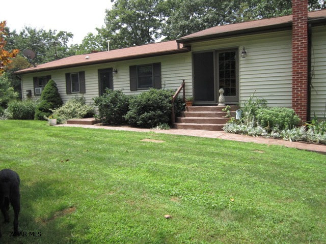 Nature surrounds this 3 BR, 2 BA home on all sides. Enjoy over 11 acres from either the back patio or wonderful private deck. The home's lg eat-in kitchen w/ granite counter tops makes cooking a dream while the lg dining room is great for relaxing and conversation. The home has a huge game room/family room addition which is surrounded by windows to capture nature. There is a lg three car detached garage as well as an attached two car garage. The back patio w/ pond is truly inviting. Great private home but located within a couple miles of Everett. Must see to appreciate....