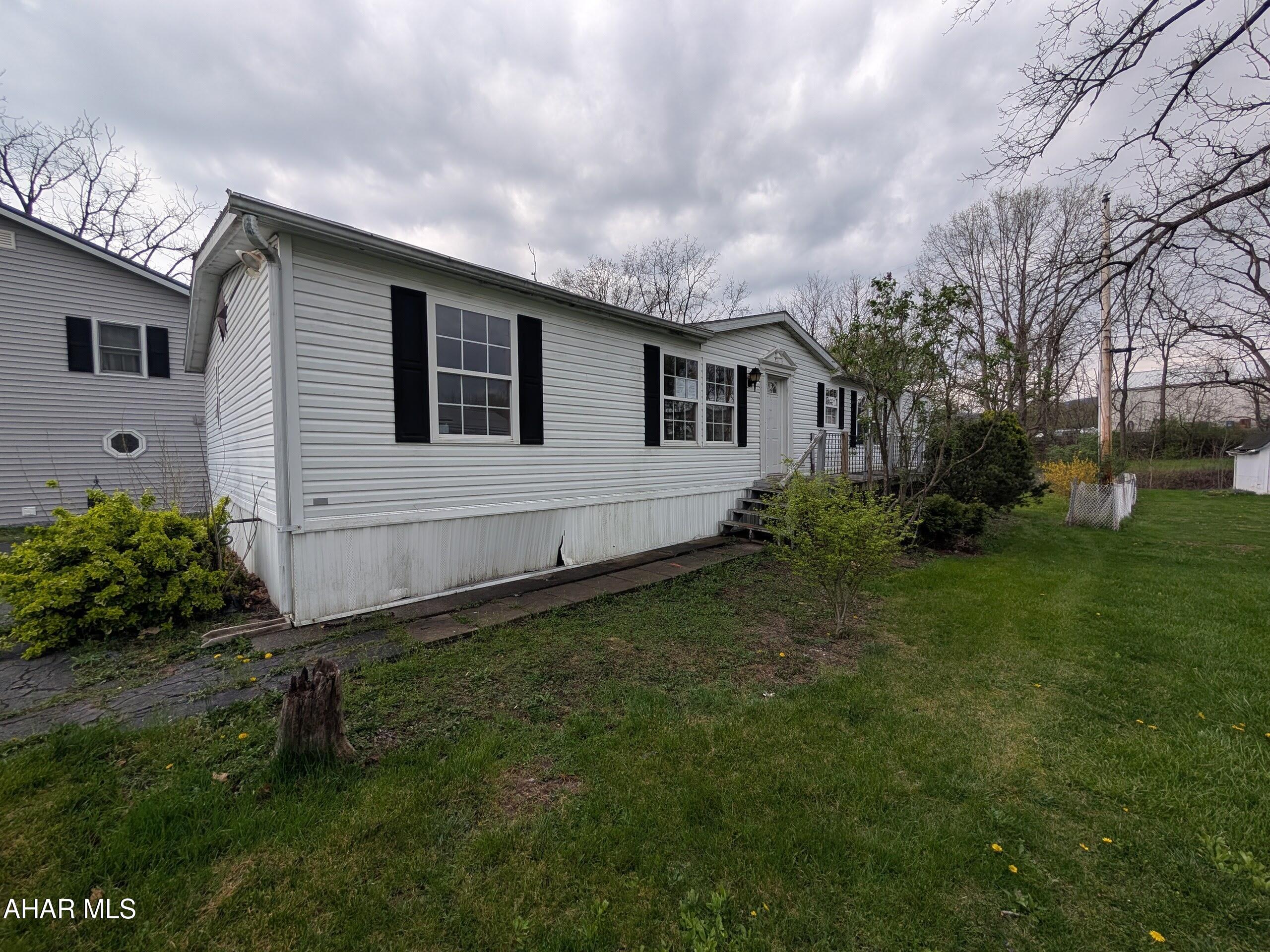 Duncansville double wide home in quiet neighborhood. Features large living room with vaulted ceilings, kitchen with adjoining dining area, large family room, master bath w/ hot tub, stand-up shower and double sinks plus 2 additional bedrooms and full bath. First floor laundry, wood deck, shed, off-street parking and more!  Property sold AS-IS. Seller will make no repairs. Offers must be submitted through HUD approved broker. Buyer pays both transfer taxes. Exclusive Agency. Equal Housing Opportunity. www.HUDHomestore.com. Property failed pressure test on plumbing.