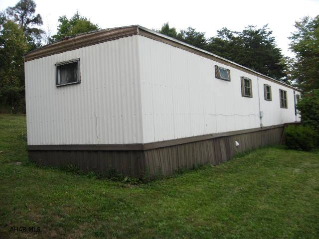 This home situated on 1.67 acres would be perfect for an affordable hunting retreat, weekend get-away or full-time living. Additional trailer w/addition provides added space for storage.