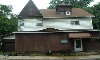 Roof 6 years / furnace 1 yr - inground pool. Good store front property - formerly a Mom & Pop store.  Very spacious and large apartment on 2nd floor.  Lot is 3.5 lots (irregular).