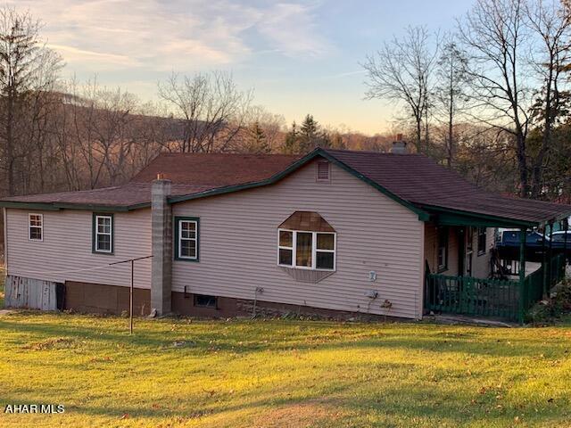 Enjoy country living on 1.04 acres! A cozy but quaint 3 bedroom bungalow has been nicely updated. Spacious eat-in kitchen, laundry/mud room w/patio door to the side deck. Laminate Fl in the living room and dining room with hardwood floor underneath. 2 of the bedrooms also have hardwood under carpet. Large yard and outside firepit and a sunset view.  A must see to appreciate!