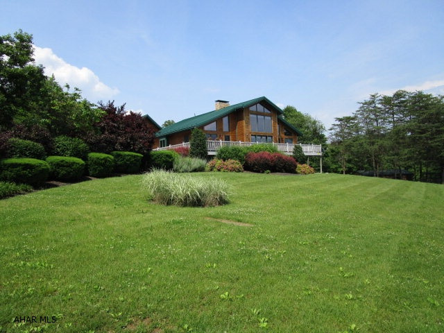 This property offers the ultimate in privacy and a park like setting. Situated 228.37 acres of scenic meadows, woods, stream, large pond filled with different fish species, and miles of private trails. The superbly maintained log home offers magnificent views of surrounding mountains and wildlife from the inside or outside. Main level has a G.R. w/cath. ceiling, kit. w/custom cherry cabinets, formal dining, informal dining, den, L.R., half bath, and master suite w/master bath. Second level has 2-additional beds, full bath, and loft with endless views. Full fin. bsmt. with rec. room, bed, full bath & bonus room. Geothermal heating & cooling, security system with cameras, main. free decking, 2-car attached garage and 2-car detached garage. Guest house on property w/all separate utilities.