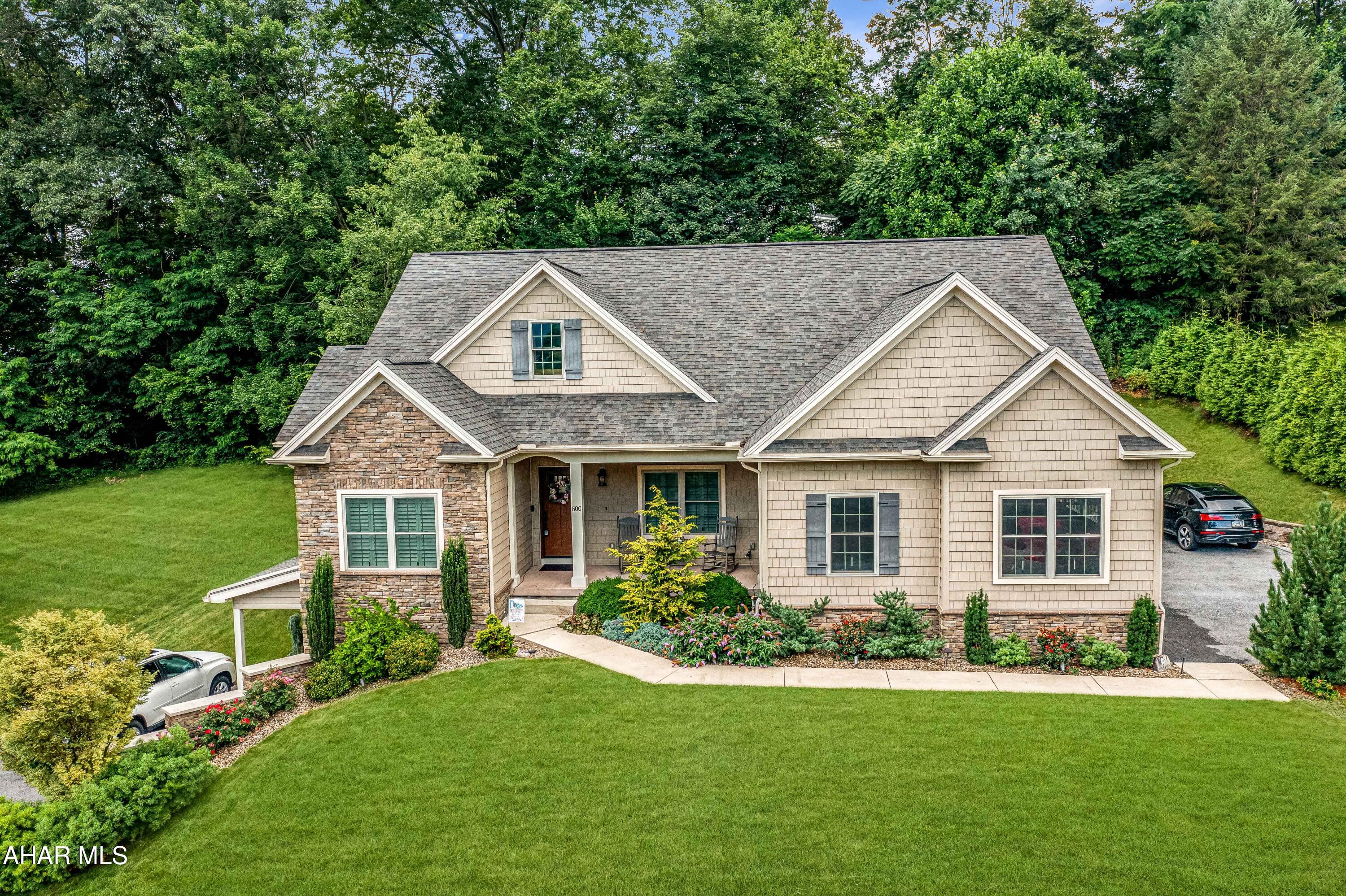 Exceptional custom-built home by Jeff Frye, ideally situated in Altoona's sought-after Highland Park neighborhood. Offering approximately 3,800 square feet of beautifully finished living space across two fully equipped levels, this home is perfectly suited for multigenerational living or potential Airbnb income. The main level features an open-concept layout with striking hickory hardwood floors, a warm gas fireplace, and a chef's kitchen outfitted with black stainless steel appliances, quartz countertops, and custom cabinetry. Upstairs includes three spacious bedrooms, 2.5 baths, and a convenient laundry room. The walk-out lower level offers full independent living with two additional bedrooms, a den, a second full kitchen with quartz countertops and stainless appliances, a private laundry area, and its own exterior entrance. Additional highlights include hot water baseboard heat with an added heat pump, a two-car garage, two separate driveways, a 10x12 shed, and professional landscaping. Built in 2017 with robust Imperial foundation walls, this home combines energy efficiency with long-lasting quality. Set on a gently rolling lot with public utilities in a quiet, established area, this turn-key property is a rare find. Don't miss the interactive Matterport 3D tour—schedule your private showing today!