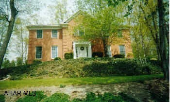 Hollidaysburg Schools.  Immaculate home. Stately 4BR brick in Elmwood.  Great view, fantastic master bedroom suite, large family room, 1/2BA in basement, C/A, tastefully decorated.
