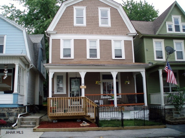 Large home at a great price. Nice flow on main level. LR has gas fireplace. Ceramic tile flooring on front porch. Relaxing deck from back door. Off street parking. Freshly painted exterior. 3 BR on 2nd floor, Finished attic w/Baseboard heat is 4th BR. Attic features 2 extra rooms for walk-in closet & computer area.
