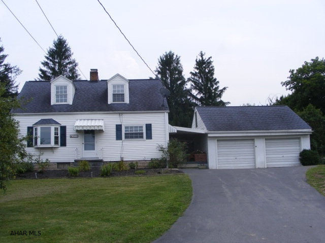 Nice Cape Cod home with breezeway to 2 story detached garage. Wonderful yard with patio. 2 bedrooms on main level and 1 on 2nd level.