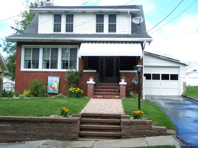 Move-in ready!!  Immaculate 3 bedroom home features ceramic tile floors, maple kitchen cabinets, 2 pellet stoves (1 in basement, other in living room), and large 2 car detached garage.