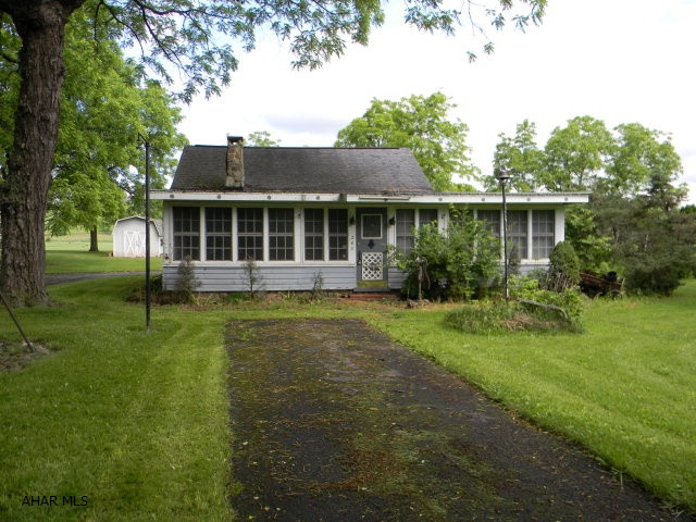 Charming cottage resting on .49 acre lot. Tons of character, 2 fireplaces, 2 full baths, 2 bedrooms & electric heat. Light & Airy with lots of windows. Can be used part time or full time. Access to Dunning Creek. Neat property.