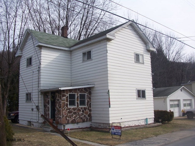 Nice 3 bedroom 1 bath 2 story with 2 lots, 2 car garage, great starter. 800 Allowance for front porch repair.