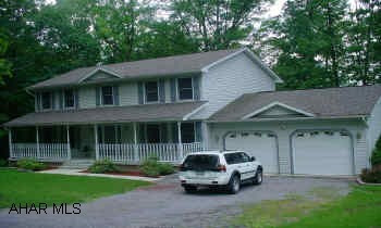 Two story, living room, dining room, kitchen with eating area, first floor family room, 4 bedrooms, 2.5 baths, large rear deck and wrap around front porch-great house. Nice 2 story home on great one acre wooded lot - formal living room and dining room, eating area in kitchen, first floor family room, 4 bedrooms, 2.5 baths, 2 skylights, large rear deck and wrap around front porch-like new condition.