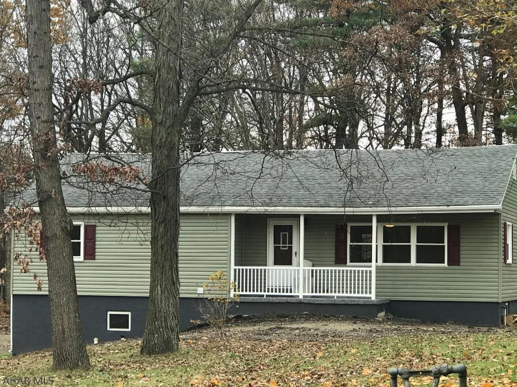 TUCKED AWAY on dead end road, and totally updated! 3 bed 1.5 bath on 1.16 acre tree lined lot in Logan Township/ Altoona School. Granite countertops and stainless appliances in brand new large and beautiful eat in kitchen! New flooring, doors, windows throughout.  Newer HVAC system.  Recreation room and 1/2 bath in basement are brand new.  New covered deck to enjoy the outdoors, woods, and expansive lawn. It will not last!  Call for appointment!