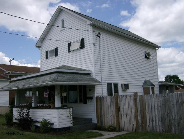 2 story vinyl sided 2 BR home with a 2 car garage and fenced lot
