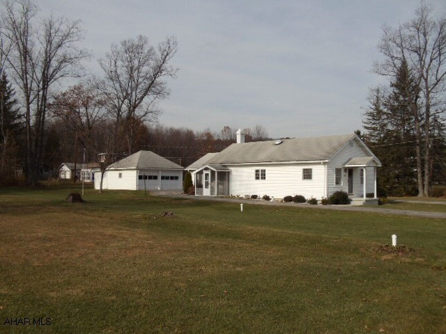 Convenient Location, Hollidaysburg School! Immaculate, 1 story, vinyl siding home with storage above, 2 car garage with shed, spacious sunroom could be used as a second bedroom, Anderson thermopane windows, eat-in kitchen, berber carpet. #J-041