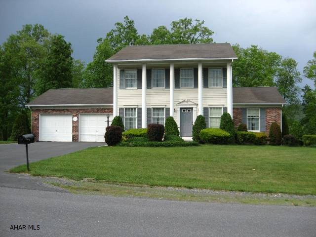Located in desirable Lakewood Manor this spacious 3 Bedroom, 2 1/2 bath home has so much to offer.  The kitchen, with eating area, opens to a family room leading to a large deck overlooking a large backyard with room for a garden and has a grove of mature oak trees, 2-car attached garage, large foyer, private living room, 2nd floor large landing with plumbing for laundry area, master bedroom with master bath and walk-in closet.  Loads of storage space in the walk-out basement.  This is a lovely home.