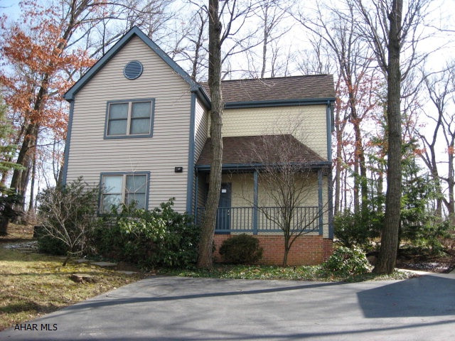 Contemporary home nestled on a private wooded lot. New corian counters. Interior newly painted. 4 zone heating. Detached garage 15x25 with storage loft. Concrete patio.