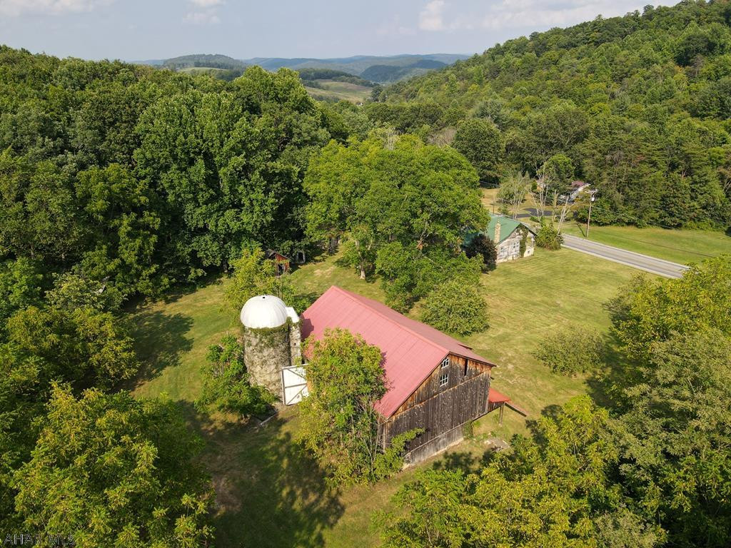 Wow...what a location!  Within minutes of Raystown Lake is this beautifully located 81.58 +/- acre farm house and great barn.  Babbling brook runs along the property and the land is graced by the scenic Allegheny Mountainside.  3 spec log homes and another contemporary home are also included in the sale.  These homes are in need of renovation but there is so much potential for a wonderful home site and so many other possibilities.  The proximity to Raystown Lake makes this a terrific investment opportunity.