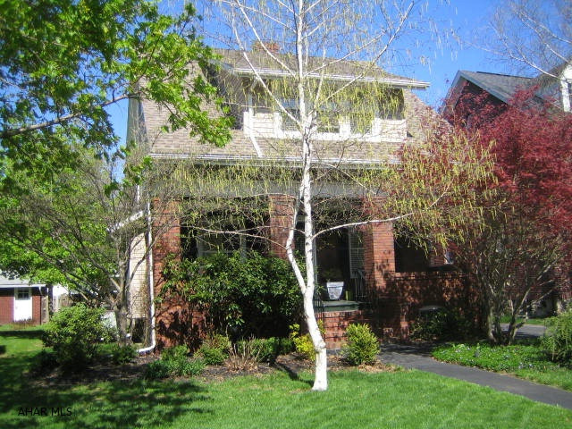 Major style points for this immaculate and handsome brick and vinyl home. Formal living room w gas FP, formal dining, hardwood floors, spectacular eat-in kitchen. First floor bath and posh family room w gas FP, custom built-ins and wet bar. 3 full bedrooms with large closets, central air, thermo windows & updated mechanics. 1 car detached garage, rear deck and relaxing front porch.