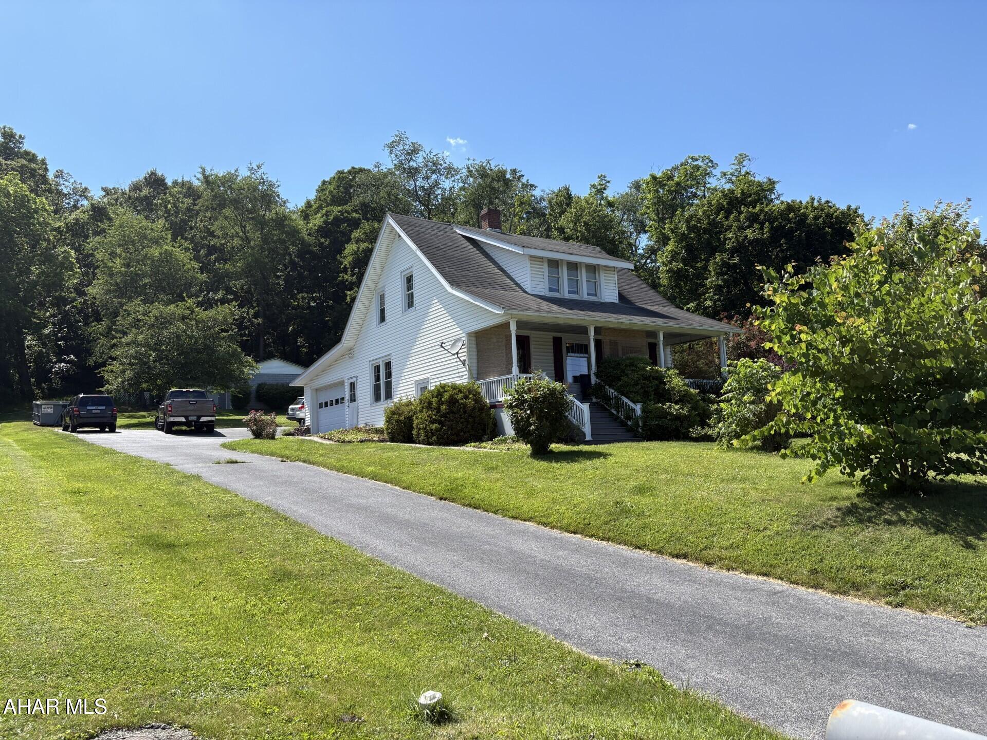 Welcome to 7516 Lincoln Highway in Bedford, Pennsylvania, a meticulously maintained 1933 home situated on 1.43 acres in Bedford Township..
This charming two-story home offers 1,522 square feet of living space with three bedrooms, two full bathroom, and a layout that perfectly blends timeless character with everyday functionality.
From the moment you arrive, it's obvious this property has been exceptionally cared for over the years. Approximately half of the property features a beautifully landscaped, flat to gently sloping yard with a paved driveway, while the other half offers a private wooded setting complete with private wooded retreat including a walking trail leading to a campfire gathering area that's perfect for relaxing with family and friends.
One of the standout features is the impressive 1,600-square-foot detached concrete block garage with electricity with welding capability, creating endless possibilities for hobbyists, mechanics, woodworkers, small business owners, or anyone needing substantial workshop space.
Inside, you'll immediately appreciate the warmth and craftsmanship of this classic home. Upstairs you'll find three spacious bedrooms, a full bathroom, and a large dressing room currently being used as a nursery that could easily serve as a walk-in closet, home office, or additional flex space. Double dormers on both the front and rear of the home flood the second floor with natural light and create a surprisingly spacious feel throughout. Abundant closet space and beautifully restored original hardwood floors add both charm and practicality.
The main level offers generous living spaces designed for both everyday living and entertaining. The large kitchen features newer cabinetry, updated appliances, and plenty of room for a dining table. A formal dining room, currently serving as an exercise room, offers additional flexibility to fit your lifestyle. The spacious living room and inviting front parlor provide comfortable gathering spaces for family and guests alike.
The covered front porch may become your favorite spot of all, whether you're enjoying your morning coffee, relaxing in the afternoon shade, or simply watching the world go by.
The basement is another pleasant surprise. Dry, immaculately clean, and exceptionally well organized, it offers excellent storage and utility space while also providing approximately 300 additional square feet of finished living area. You'll even find a classic Pittsburgh toilet, adding a touch of nostalgia and practicality.
Homes of this quality, condition, and versatility don't come along often. If you've been looking for a property that combines character, usable acreage, workshop space, and a location that's convenient to everything Bedford has to offer, this one deserves a closer look.


Chris Evans

Howard Hanna Bardell Realty
115 S. Anderson Street
Bedford, PA 15522
814-623-8622-Office
814-505-5224-Cell
https://www.youtube.com/shorts/hYdBDagVAIQ

chrisevans@howardhanna.com

Consumer Notice:
''The Real Estate law requires that I provide you with a written consumer notice that describes the various business relationship choices that you may have with a real estate licensee.  Since we are discussing real estate without having the benefit of the consumer notice, I have the duty to advise you that any information you give me at this time is not considered to be confidential, and any information you give me will not be considered confidential unless and until you and I enter into a business relationship. At our first meeting I will provide you with a written consumer notice which explains those business relationships and my corresponding duties to you.