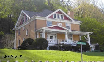 Well kept home in borough-wonderful views... 2 porches-private road, maintenance agreement-finished attic.