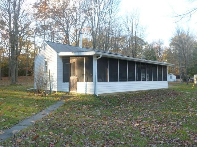 This is a great family or hunting camp.  Approximately two acres with cabin, one car garage, and optional campers means room for all your friends and family.  Cabin has a kitchen / family room, bedroom and full bath on a crawl space.  Great deep full front screened in porch offers extra living space.  Garage has space for storage and attached 3/4 bath.  Nice wooded area to bring the family for quality time together or to base your hunting trip.  Two optional campers are on the property if you need more accommodations.  City water, septic, electric.