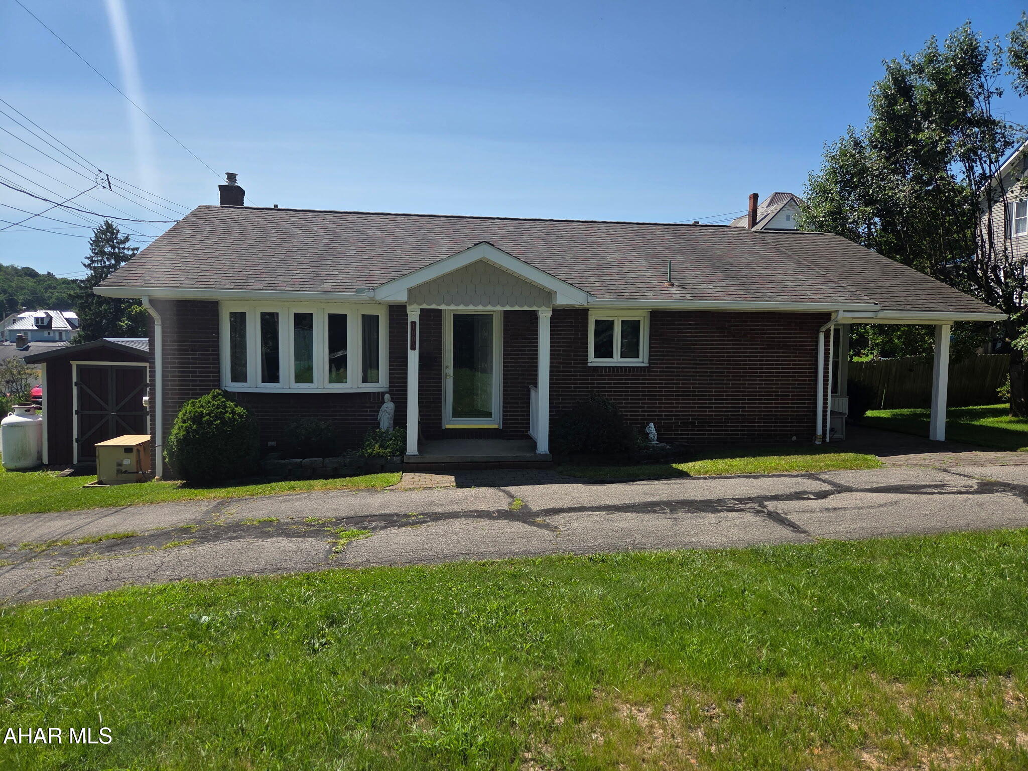 Beautifully maintained one story brick home offering easy first floor living! The spacious living room is filled with natural light, creating a warm and inviting atmosphere. The eat in kitchen features plenty of cabinet space, making meal preparation and storage a breeze.
Two generously sized bedrooms are separated by a full bath, with ample closet space throughout the home. The large finished basement provides additional living space with a cozy family room featuring a gas fireplace, a spacious entertainment area, abundant storage closets, and a second cooking area complete with a gas stove and an additional refrigerator, making it ideal for entertaining or everyday convenience. Just off the kitchen, you'll find a charming enclosed porch that is perfect for relaxing with your morning coffee or gathering with family and friends. Lovingly cared for and exceptionally well maintained, this move in ready home offers comfort, functionality, and timeless appeal.