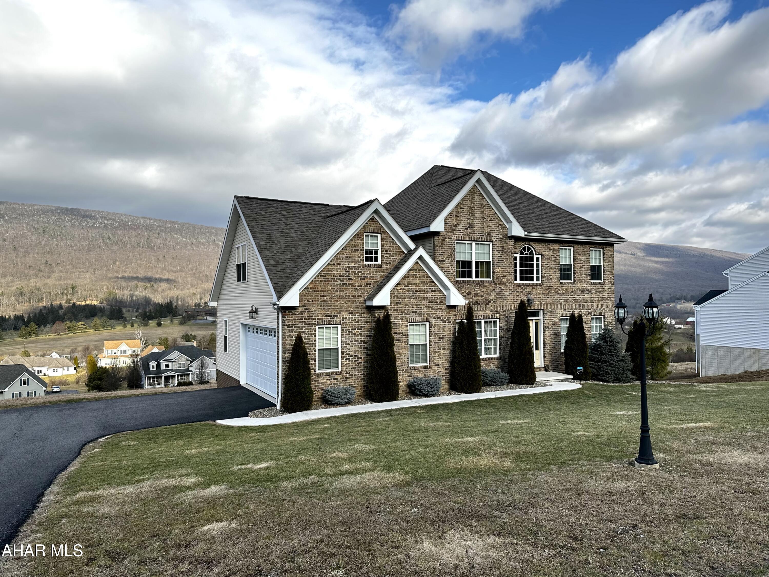 Overlooking beautiful Scotch Valley, this 5 bedroom home built in 2014 has so much to offer! The first floor is open with an abundance of natural light. The kitchen is open to the living room, where you will find a fireplace that provides the perfect ambiance. The kitchen and living room opens up to the rear deck, where you can enjoy breathtaking views of the valley and golf course. These views can also be seen from nearly every room in the house. The first floor bedroom with an attached bathroom is also a potential spot for a home office. Upstairs, the owner's suite features a spacious bathroom with a soaking tub and walk-in closet. Additionally, there are 3 more bedrooms with a laundry room on the second floor. The walkout basement offers endless possibilities, with large windows to showcase the valley and plumbing in place for a bathroom. The sellers installed a water softener with reverse osmosis system in December 2022. Call to see this stunning home!
