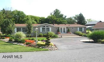 BEAUTIFULLY LANDSCAPED ONE STORY DOUBLE WIDE WITH 2 CAR GARAGE, 3 BEDROOMS, TWO BATHS. IMMACULATE. LOCATED ON DOUBLE LOT. LOT RENT IS $330 PER MONTH INCLUDES WATER/SEWER, TRASH & SNOW REMOVAL.  BEAUTIFULLY LANDSCAPED ONE STORY DOUBLE WIDE WITH GARAGE AND BONUS ROOM, 3 BEDROOMS, TWO BATHS. IMMACULATE. LOCATED ON DOUBLE LOT. LOT RENT IS $330 PER MONTH INCLUDES WATER/SEWER, TRASH & SNOW REMOVAL.