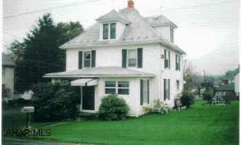 Traditional updated two-story. Hardwood floors, newer carpet, large rooms and corner property. Vinyl siding, modern bathrooms, large rooms, attic is walk-up, easily converted to bedrooms. Sold as is. Seller will give $2,000 allowance for roof.