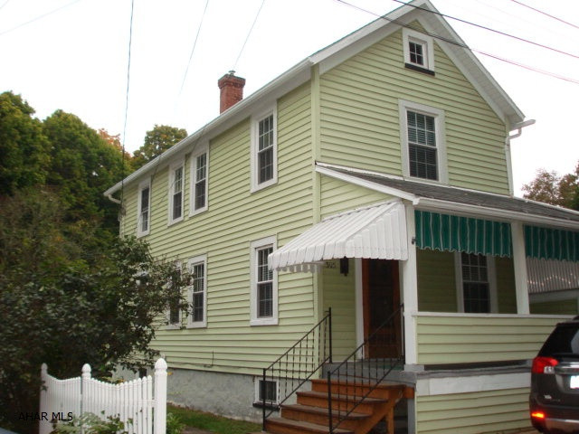 Very nice starter home or investment property, move-in ready.  This property boasts central air, thermo-pane windows, hardwood floors, backyard, carport and vinyl siding.  Attractive pavers at the front and side walkway, adds an extra parking space.  Bonus room could be used in many different ways.