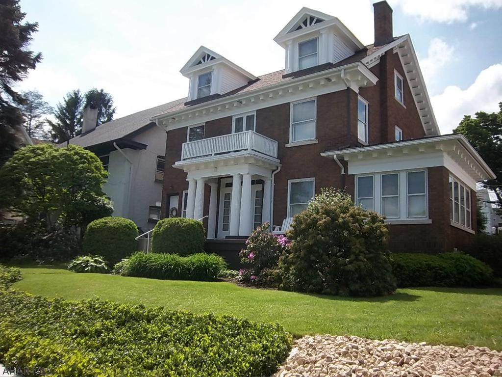 This home is a thing of beauty. . Solid brick with 3+ bedrooms and 2 full baths and two car garage..  Enjoy your morning coffee in the private courtyard. Home has lovingly been restored to it's original charm. Hardwood Floors throughout entire home.  Single/Multi family or light commercial.