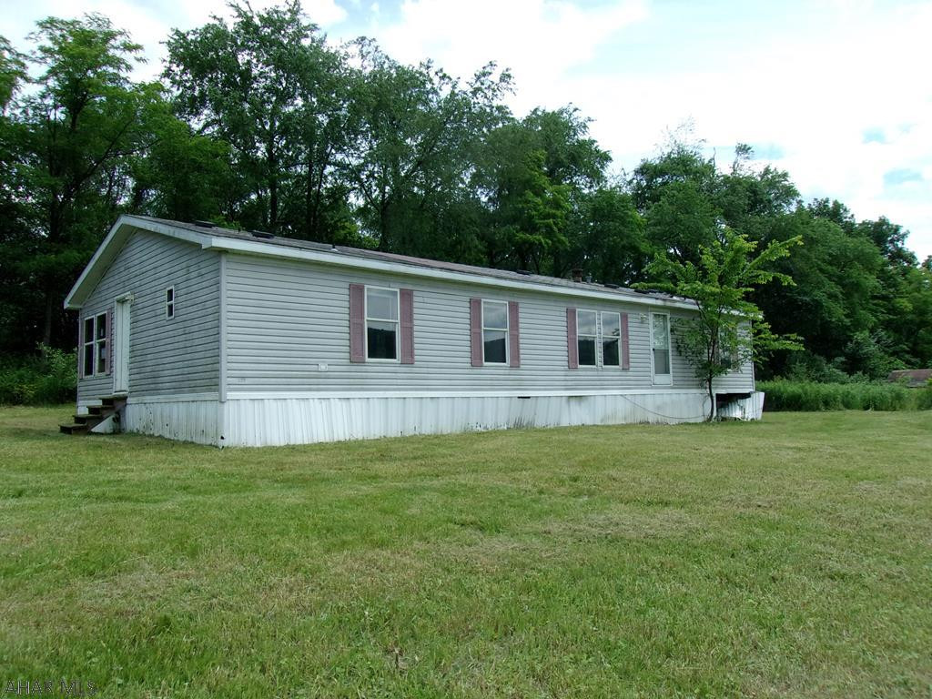 It's all about the view! Each season will be a delight. Doublewide could be a rehab project or make this the building site for your new home. 3 acres w/workshop/ barn.
