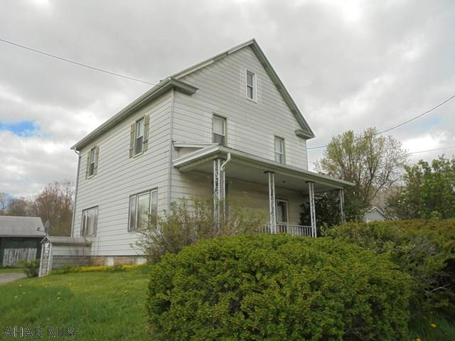 Ebensburg-  2 story aluminum sided 4 BR home on 1 acre.  Gas HW heat. 1 car detached garage.