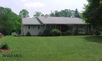 Nice eat-in kitchen, built-in appliances, pool, large family room with gas fireplace could be 3 or 4 bedrooms with large, rear covered deck.  Fridge, washer/dryer and pool equiptment stays. Very nice house, much larger inside than it looks.