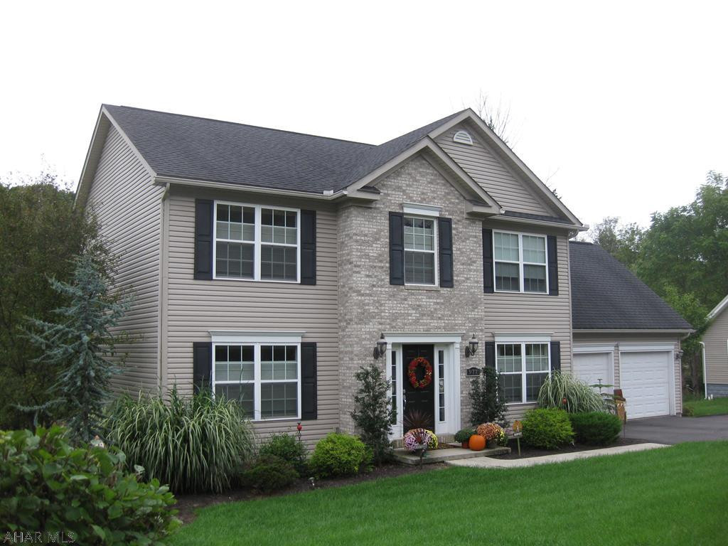 HIGHLY motivated sellers!! Do not miss your chance on owning this beautiful two story home that has four bedrooms and 2.5 bathrooms. Main level offers an open floor style kitchen that includes stainless steel appliances and a large office. Second floor offers 4 large bedrooms, which includes a master bedroom and master bathroom with  a huge walk-in closet. The basement is partially finished that is a gorgeous man cave that has a large wet bar and huge living area.