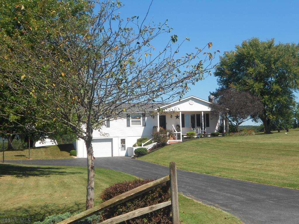 Lovely Ranch home on 1.722 acres. Just what everyone is looking for, 3 bedrooms, 1 full and 1 half bath. Nice size living room with Bay window, open kitchen, dining area with lovely new flooring through out. Inviting Sunroom off the Dining room for relaxing. New appliances, main level laundry for added ease. All windows have been replaced and a new roof recently put on entire home. Outside features a detached 2 car garage, outside shed and easy care yet beautiful landscaping. Views of the mountain and country side are breath taking. Call to see this one owner home!